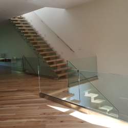 indoor staircase with glass railings