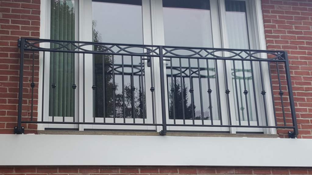 second floor window with Wrought iron railings