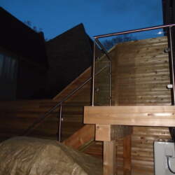 deck-glass-railing-in-the-dark