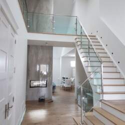 glass-railing-with-stainless-steel-frame-and-top-rail